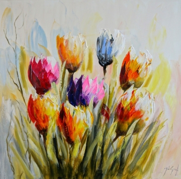 Kleurige tulpen in diverse tinten zoals rood, roze en paars, omringd door groene bladeren en kleurrijke bloemen.